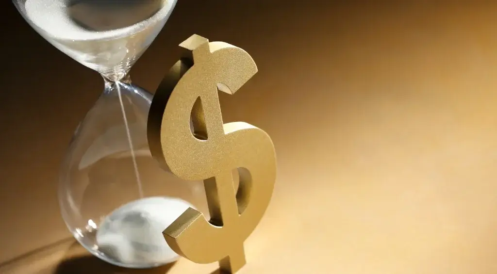 cifrão com ampulheta